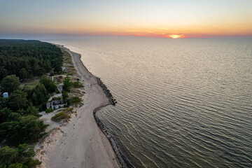 Aerial view of sunset above Cape Kolka and its surroundings in Latvia, Autumn 2024