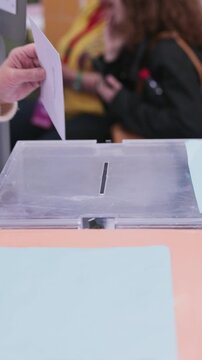 Girl close up hand on ballot box voting candidate. Unrecognizable Hispanic child. Background