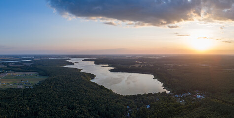 Aerial landscape skyline view of Powidz lake and Anastazewo beach (Jezioro Powidzkie, Plaża Anastazewo) at sunset. Popular summer resort in Wielkopolska, Poland © uslatar