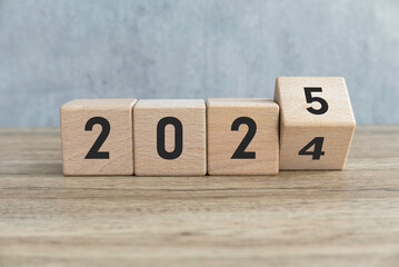 Transition from 2024 to 2025 Represented by Wooden Blocks with Numbers