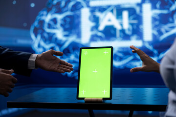 Admin running AI cognitive computing tech on chroma key tablet to simulate computerized model....