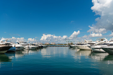 Sailboat moored to pier in yacht marina. Sailing and yachting tourism. Luxury lifestyle. Vacations...