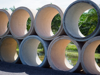 Cement pipe draining water on the road