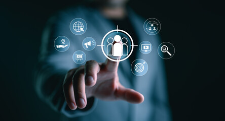 Digital marketing and targeting concept. Businessman touching on icon targeting, customer engagement, Global reach, Modern strategies in online marketing, customer acquisition, sales growth.
