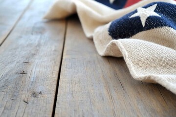 A close-up of a rustic wooden table with an American flag draped over the corner.