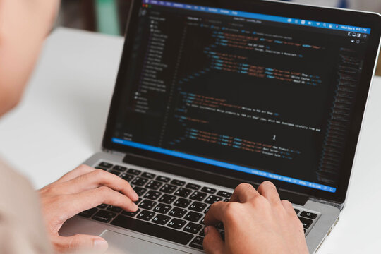 Digital technology, software development concept. Developing programmer, software developer coding computer code on laptop computer. Perfect for coding, IT solutions, applications, coding javascript
