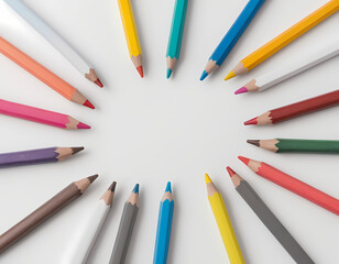 Naklejka premium A Blank White Sheet of Paper With Colorful Pencils Around It