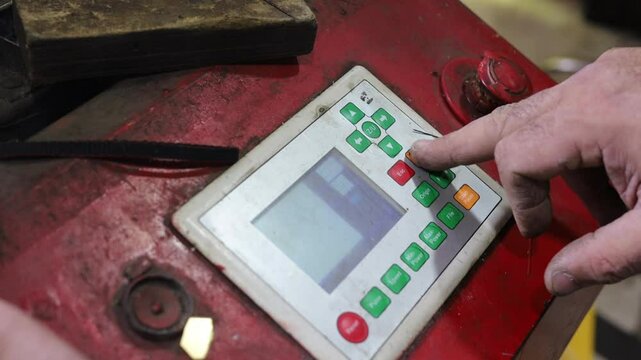 The hand of the master picks up the task for cutting