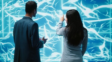 IT staff members using artificial intelligence computing simulating human brain thought processes....