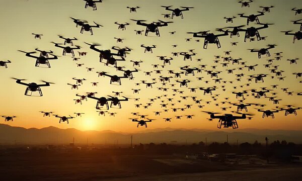 A swarm of drones flying against a sunset backdrop, showcasing technology in motion.