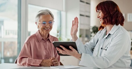 Doctor, tablet and high five with patient for senior care, healthcare or test results in hospital. Oncologist, elderly woman or tech in consultation for feedback, cancer free or excited for good news
