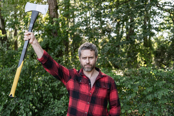 Hispanic lumberjack man with axe. Lumberjack axe. Portrait of mature man with logging axe. Hardworking brutal man. Lumberjack hardworking outdoor. Brutal lumberjack. Brutality and masculinity