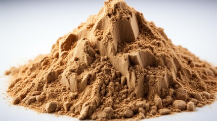 A pile of brown powder on a white background