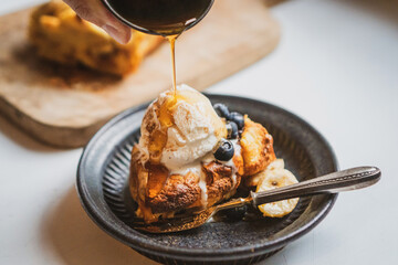 Rich chocolate ice cream drizzled with decadent syrup