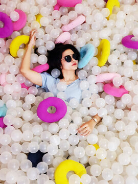 Woman in blue top wearing sunglasses