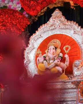 Statue of lord Ganesha with red background