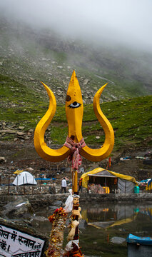 Trident close up shot placed near Manimahesh lake surrounded with mountain