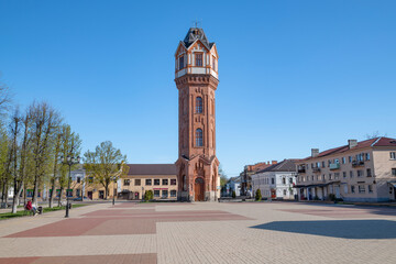 Fototapeta premium An ancient water tower on the town square on a sunny May day, Staraya Russa