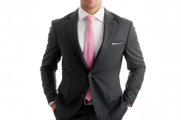 A well-dressed man in a formal suit with a pink tie, exuding professionalism and confidence against a black background.