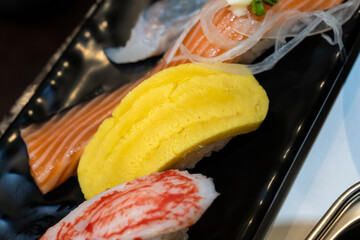 various sushis of salmon, egg, and imitation crab meat © 안구정화