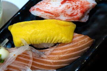 various sushis of salmon, egg, and imitation crab meat © 안구정화
