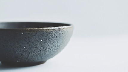 empty black ceramic bowl on white background minimalist still life product photography