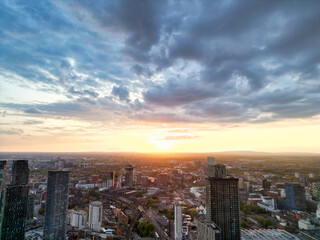 Obraz premium Aerial View of Greater Manchester City Centre and Tall Buildings During Golden Hour of Sunset, England UK. High Angle View Was Captured with Drone's Camera on the day of May 5th, 2024