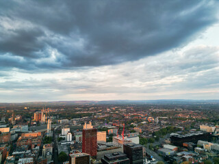 Fototapeta premium Aerial View of Greater Manchester City Centre and Tall Buildings During Golden Hour of Sunset, England UK. High Angle View Was Captured with Drone's Camera on the day of May 5th, 2024