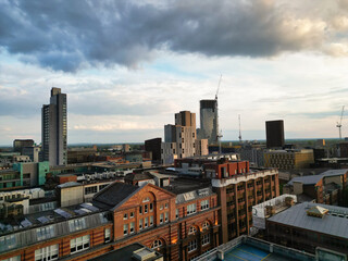 Aerial View of Greater Manchester City Centre and Tall Buildings During Golden Hour of Sunset, England UK. High Angle View Was Captured with Drone's Camera on the day of May 5th, 2024