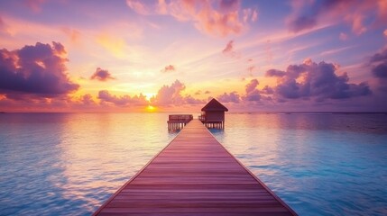 Obraz premium Amazing beach landscape. Beautiful Maldives sunset seascape view. Horizon colorful sea sky clouds, over water villa pier pathway. Tranquil island lagoon, tourism travel background. Exotic vacation 