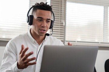 Young Black Man in White Shirt Engaging in Online Meeting