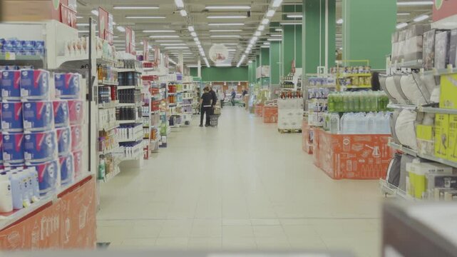 Many different products supermarket shelf. Grocery store aisle. Lots of food goods at market. People buying fresh meals hypermarket time lapse. Retail sale. Merchandise assortment. Person buy stuff.