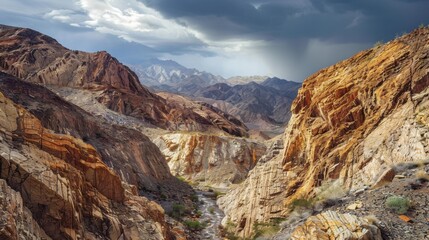 Fototapeta premium A breathtaking view of a remote, high-altitude desert canyon with dramatic, colorful rock formations and a rare desert rainstorm