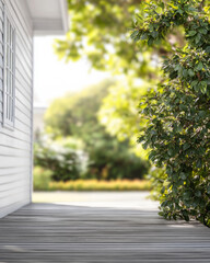 A serene porch with wooden flooring and lush greenery during a sunny day in a tranquil garden