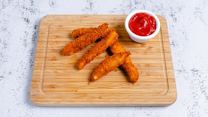 Chicken strips on tray