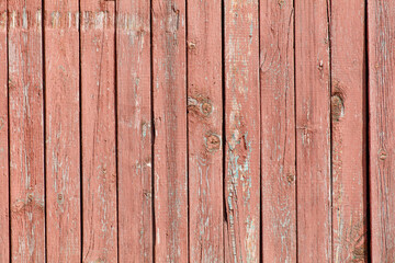 The image is of a wooden board with a red and brown color