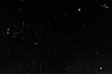 The dark surface showcases a mixture of scratches and small dust spots, creating an intriguing...