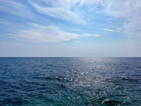 Blue sea blue sky white clouds 