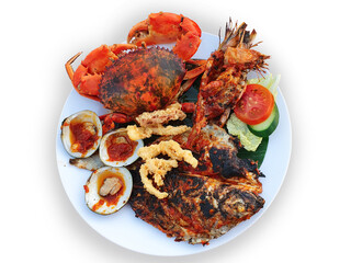 A Plate of Grilled seafood. Jimbaran Seafood Bali. Top view.