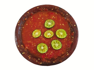 Sambel Terasi, Sambel Tempong with lime on the top, Spicy Tomato Sauce for Indonesian Side Dish Menu. Top View Isolated on White
