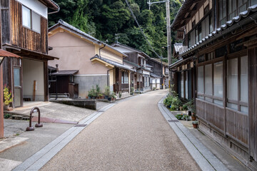 Obraz premium Ine Fishing Village, is famous for its unique funaya, or boat houses. These wooden buildings sit right on the water and serve as both dock and home for the fishermen