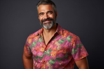 Fototapeta premium A man in a floral shirt is smiling