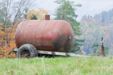 Livestock watering tank on the pasture. Watering place for cows.