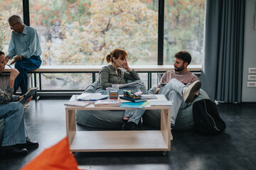 A professor interacts with students in a casual setting, fostering discussion and collaboration on...