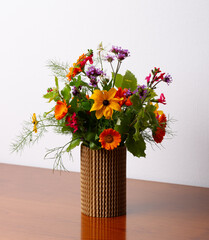 Floral arrangement with beautiful autumn flowers in a vase