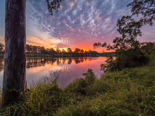 Sunset Over the River with Reflections