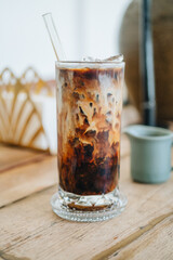 Iced americano with milk on the table