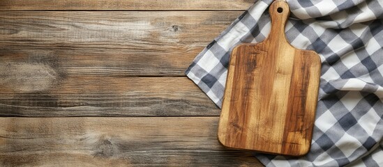 cutting board and tablecloth on wooden table surface top view. with copy space image. Place for adding text or design
