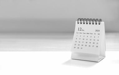 White small desk calendar of December 2024 for plan and reminder isolated on white background with copy space. Simple planner 12th month banner, for business agenda and schedule concept.