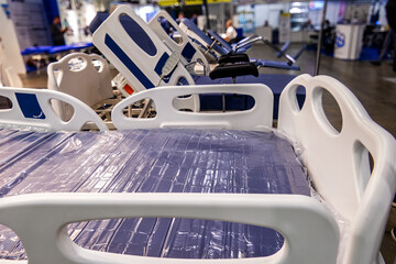 Two-section medical bed with remote control and electric control.